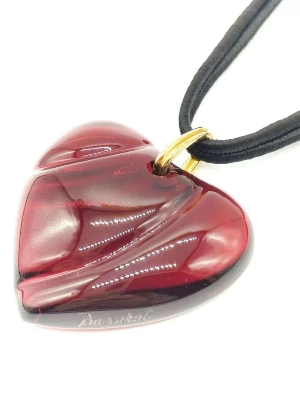 vintage Baccarat red crystal heart pendant necklace featuring a deep ruby-colore